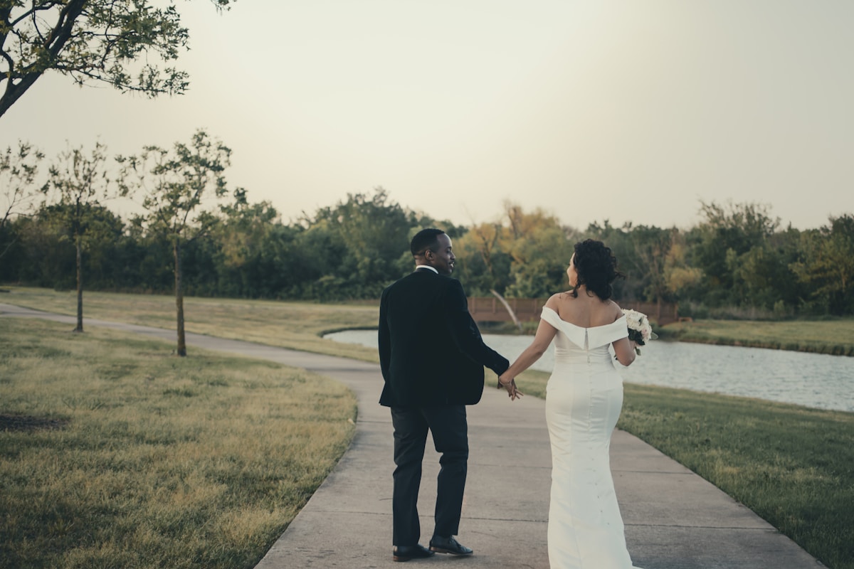 Houston Wedding Photographer man and woman holding hands while walking on road during daytime