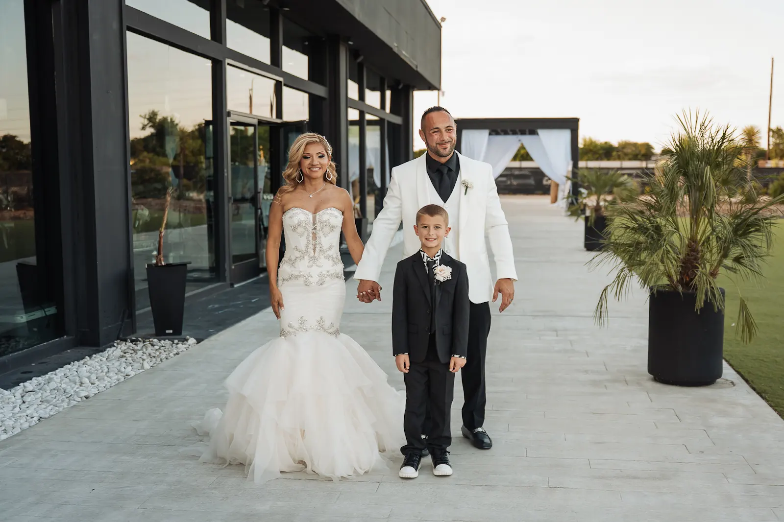 Adrian and Nancy share a family moment during their wedding day