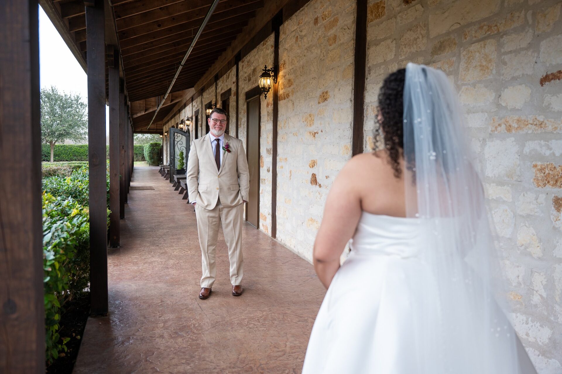 Thomas facing Macee along the covered walkway