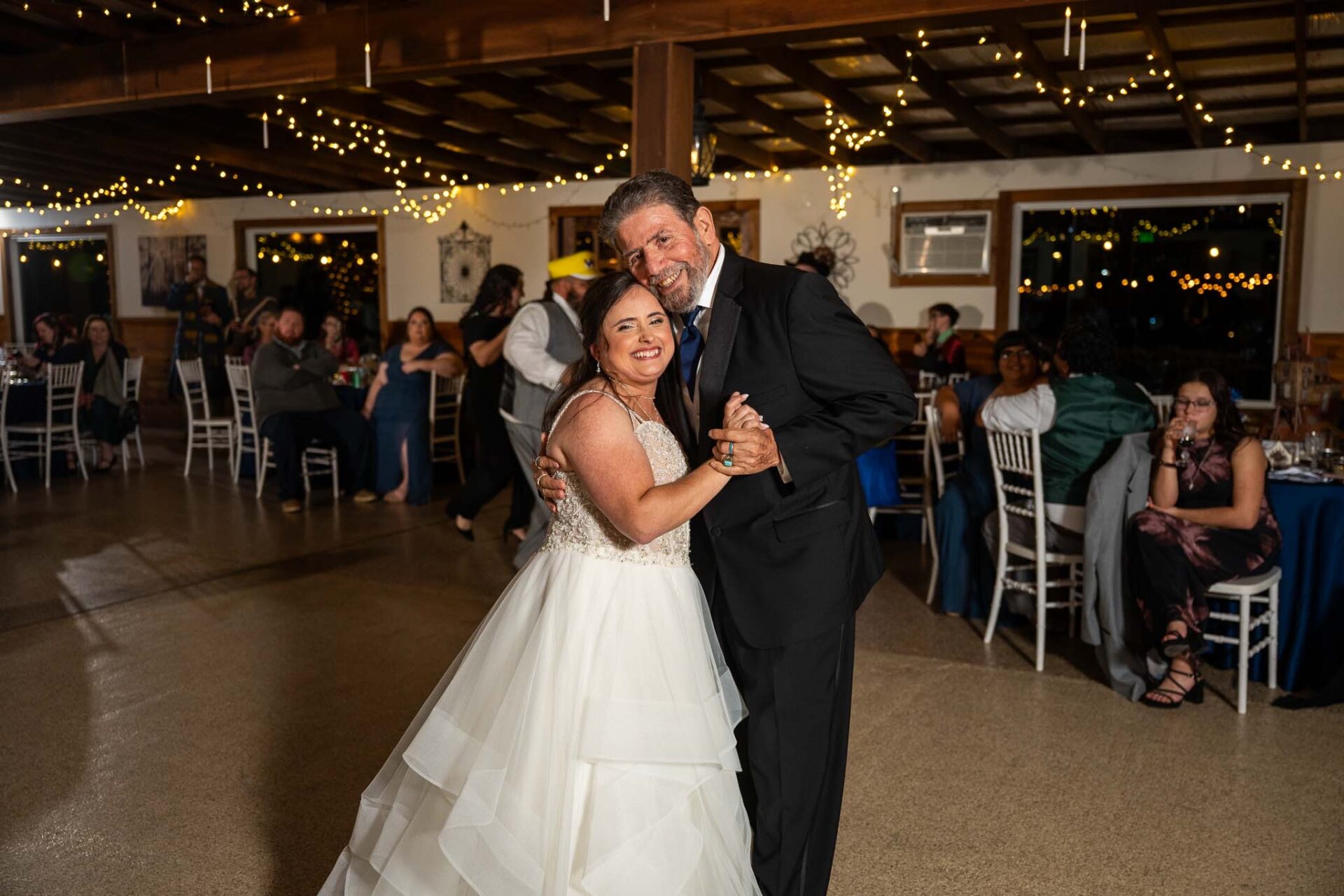 Andreea shares a dance with her father at the ranch reception.