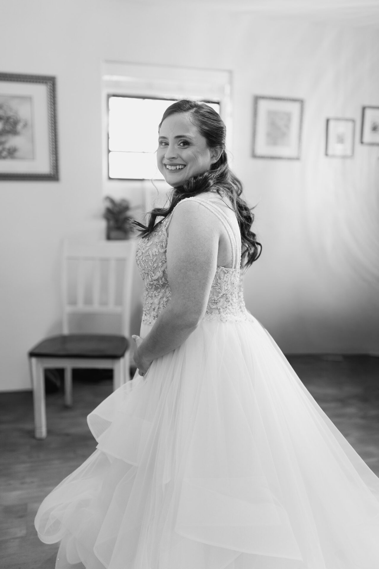 Black-and-white portrait of Andreea in her wedding dress before the ceremony.
