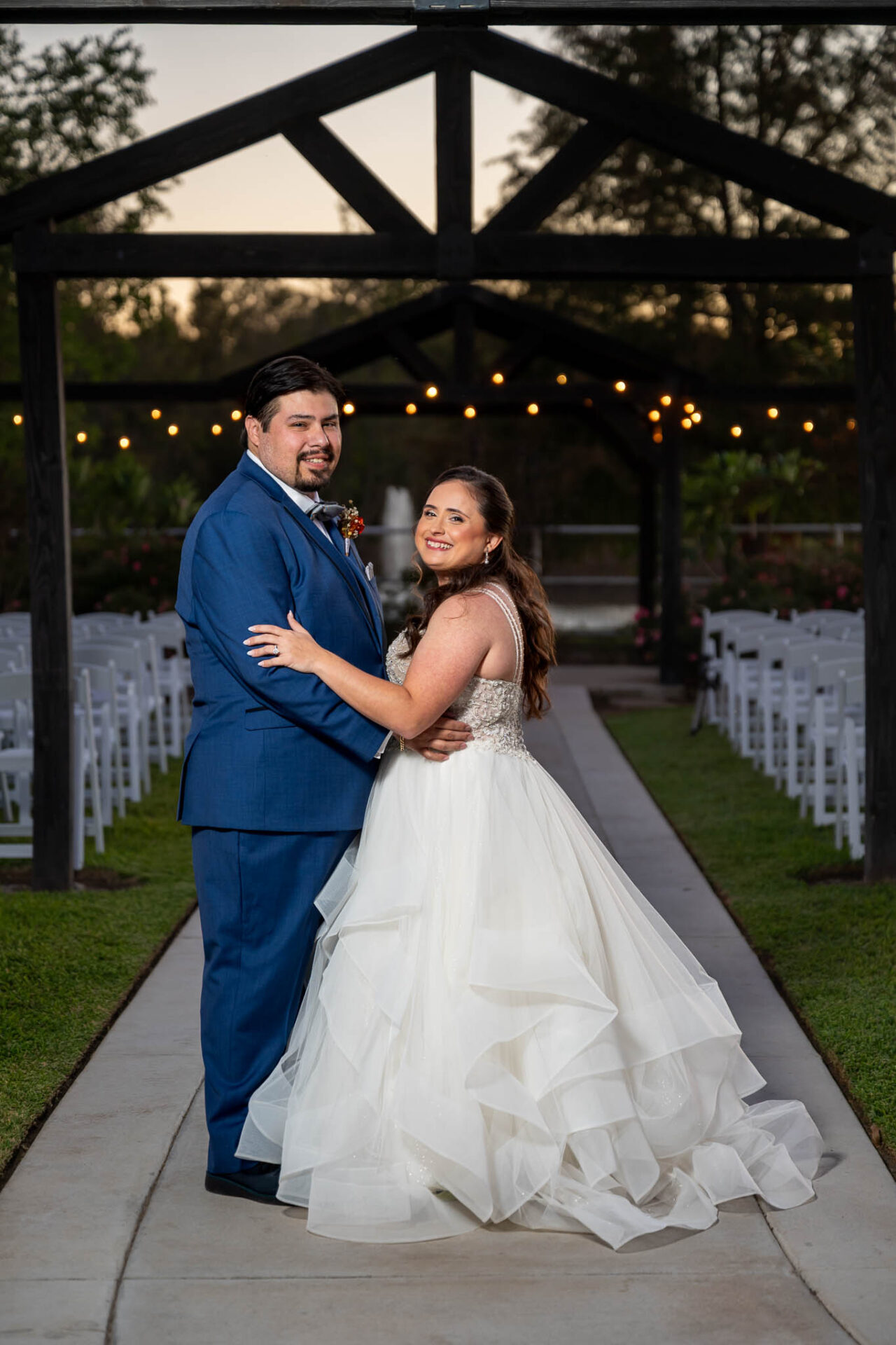 Andreea and Ram pose beneath the pavilion after sunset.
