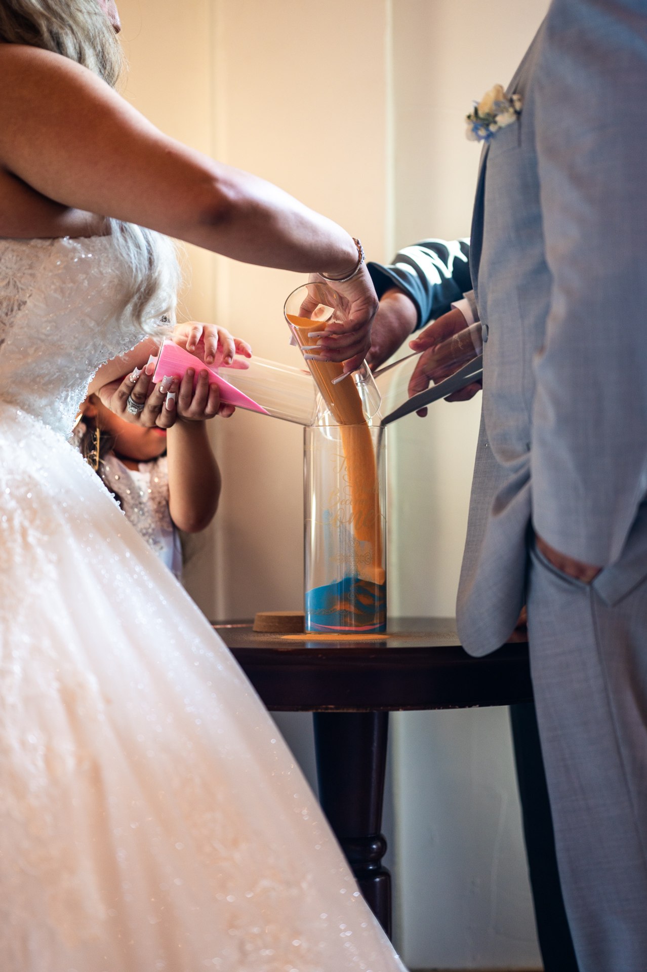Close view of the couple’s hands during the wedding ceremony