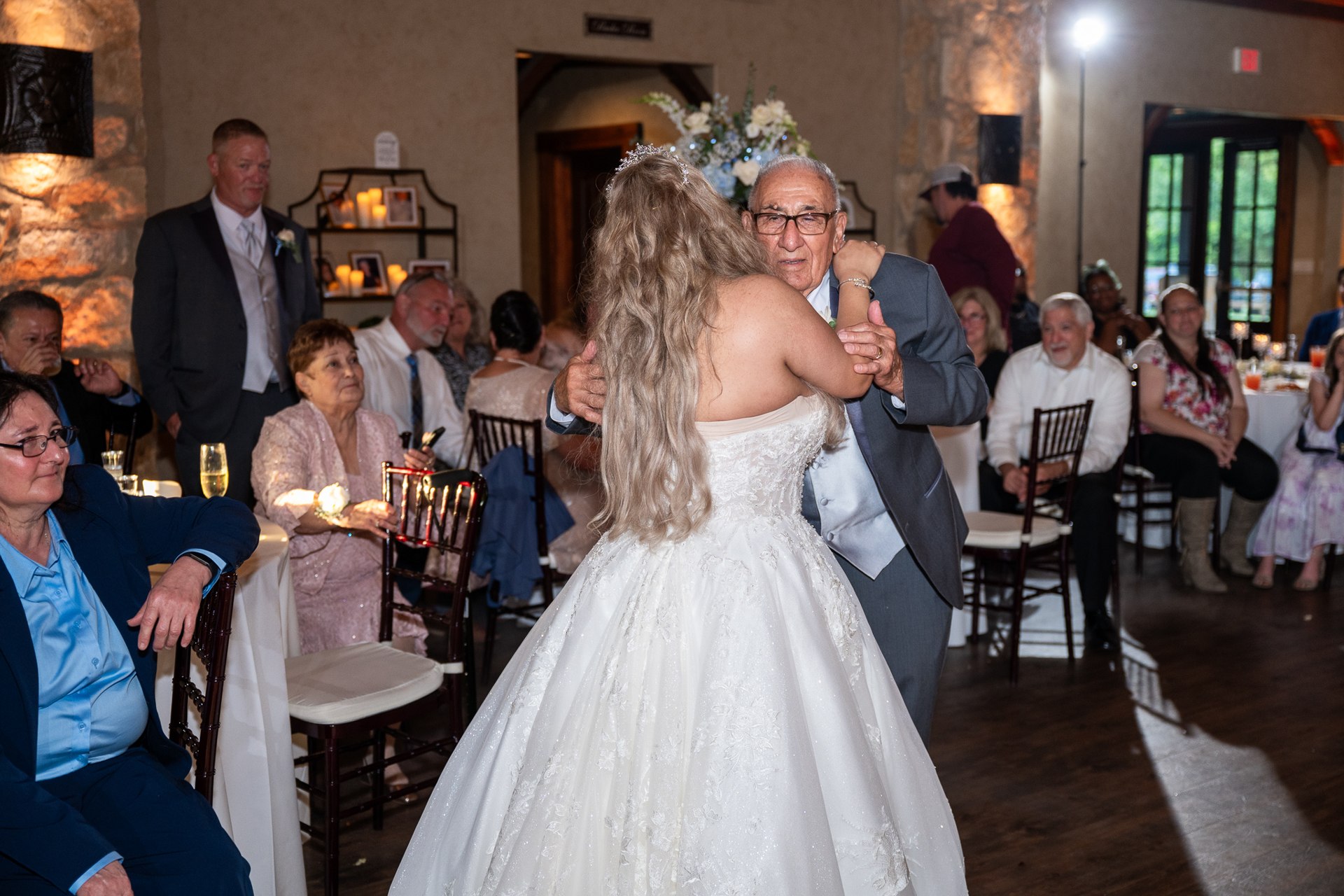 Marissa dancing with a family member during the reception