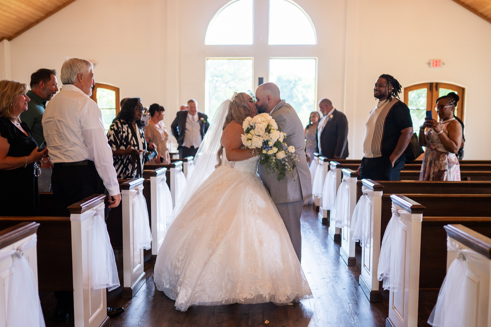 Elijah and Marissa walking down the aisle after their ceremony