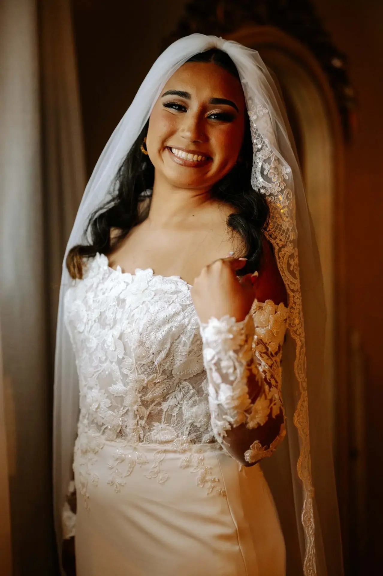Close portrait of Vanessa wearing her wedding veil