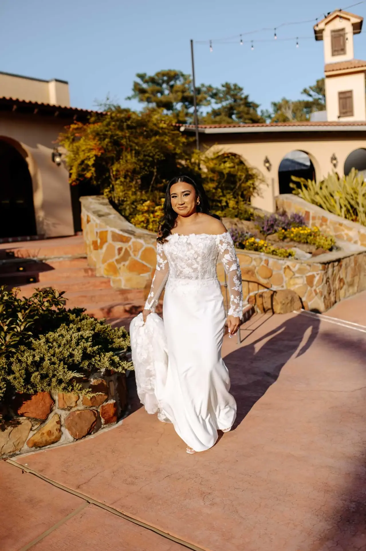 Vanessa standing in the courtyard with Madera Estates behind her