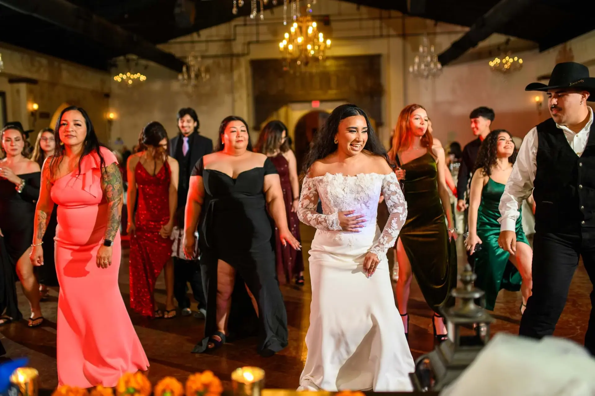 Vanessa dancing with wedding guests in the reception room