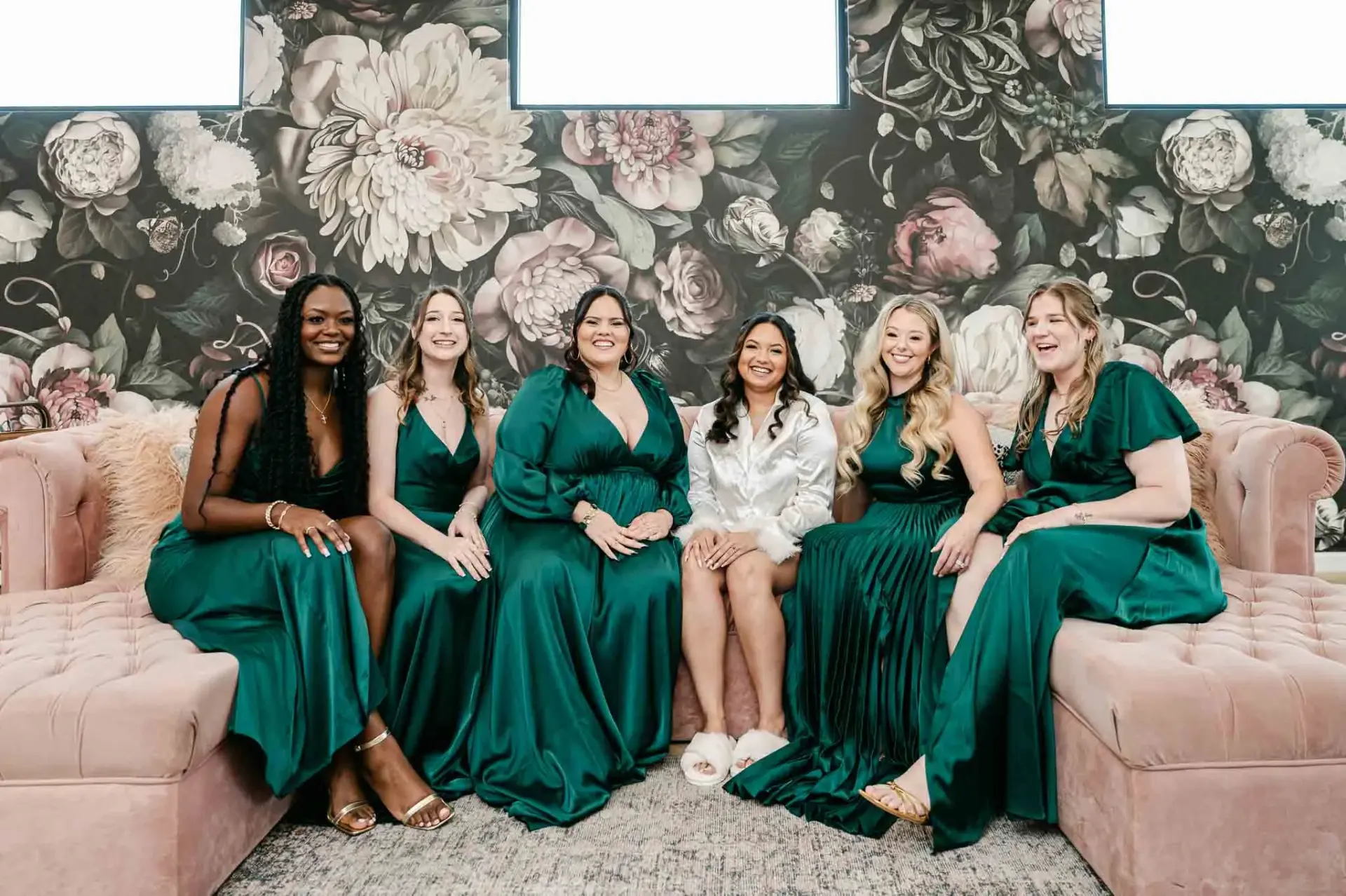 Lauren sitting with her bridesmaids in the getting-ready suite