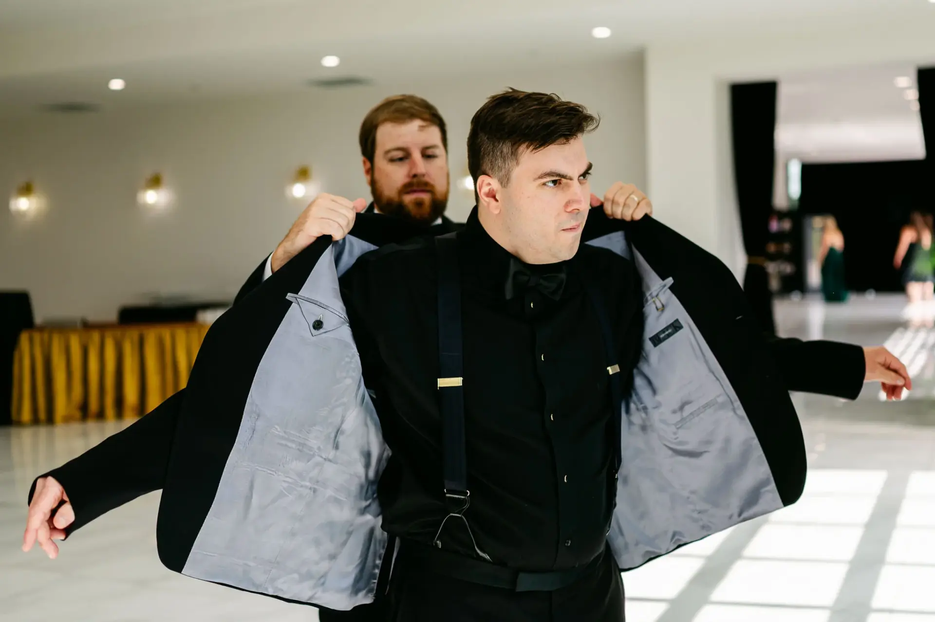 Kyle’s jacket being adjusted before the ceremony