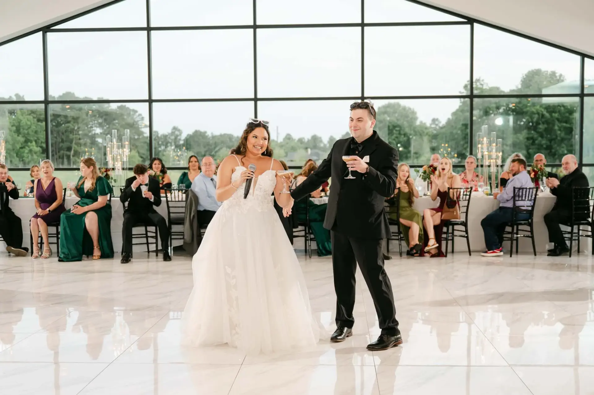 Kyle and Lauren sharing their first dance as guests watch