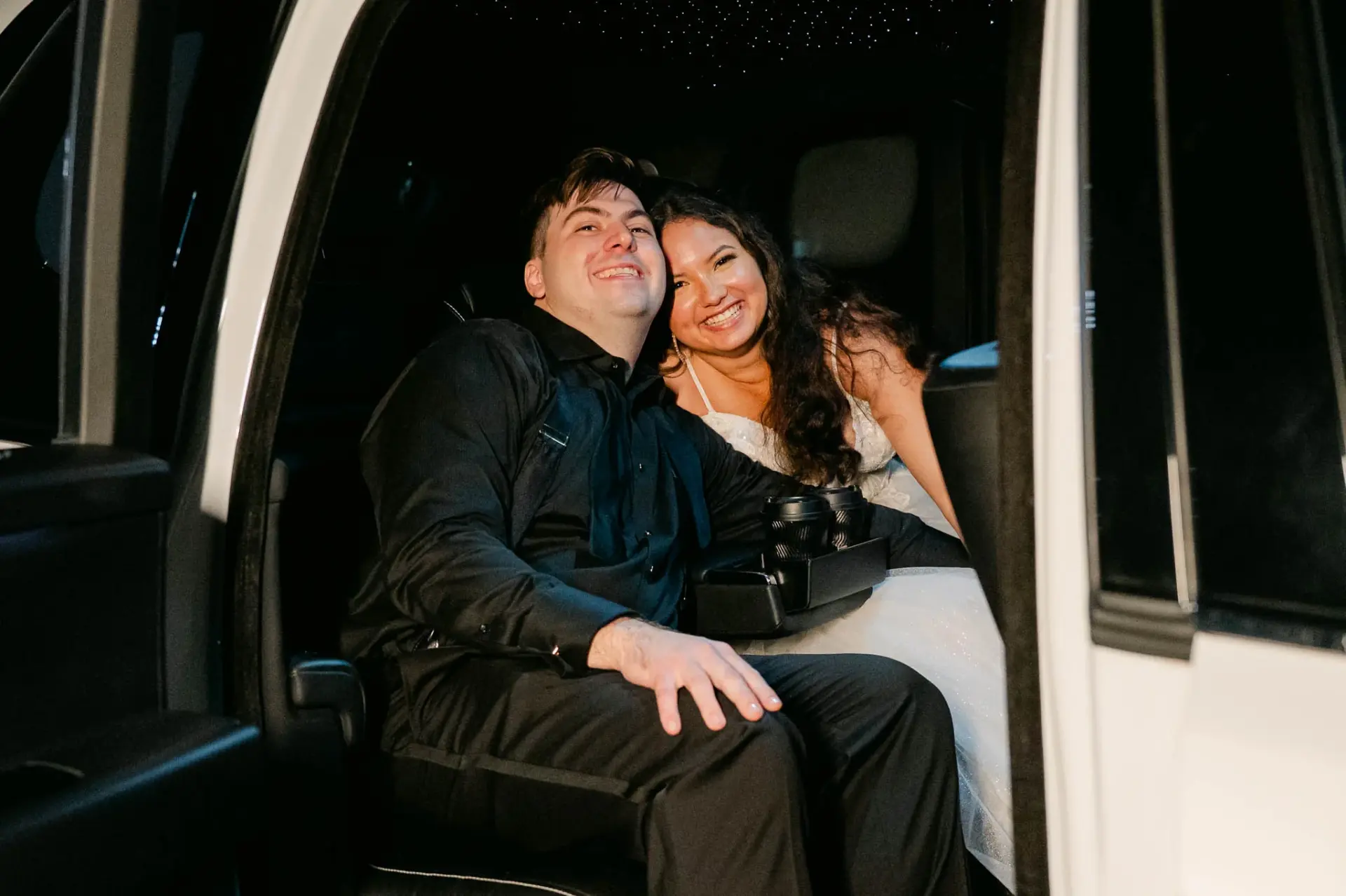 Kyle and Lauren sharing a moment inside their getaway car