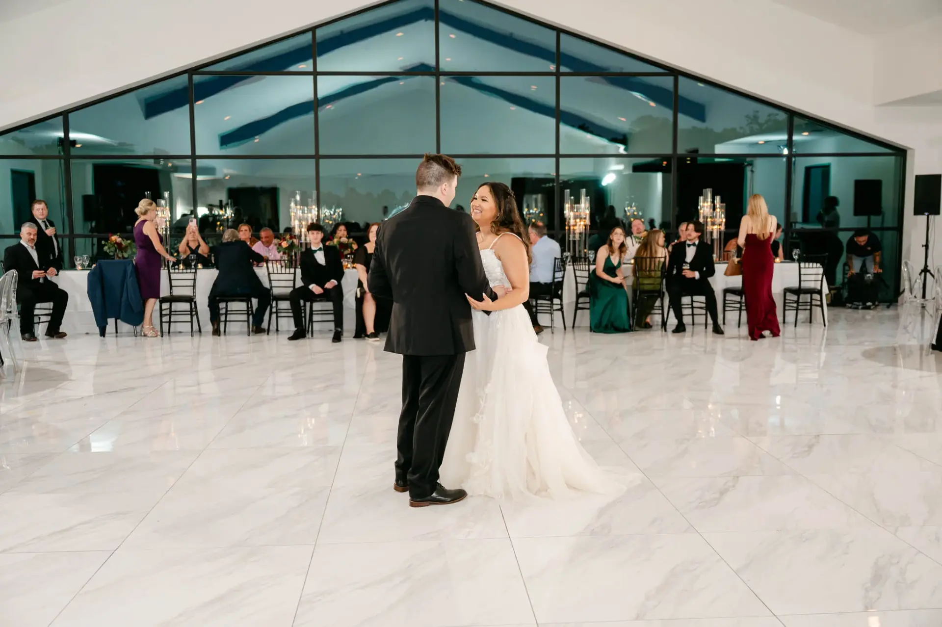 Guests celebrating on the reception dance floor