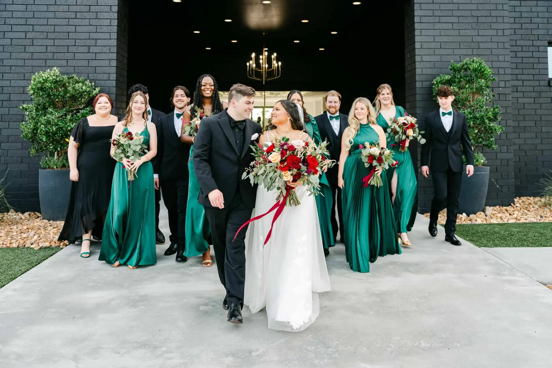 Kyle and Lauren walking with their wedding party