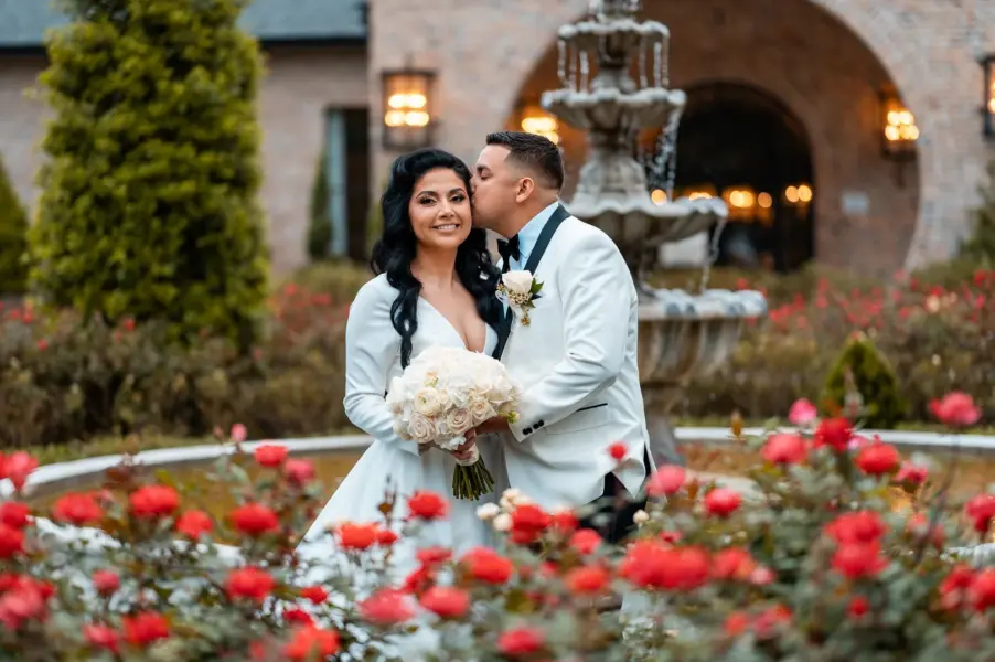 A Houston wedding photographer documents a joyful moment between a bride and groom during their outdoor ceremony.